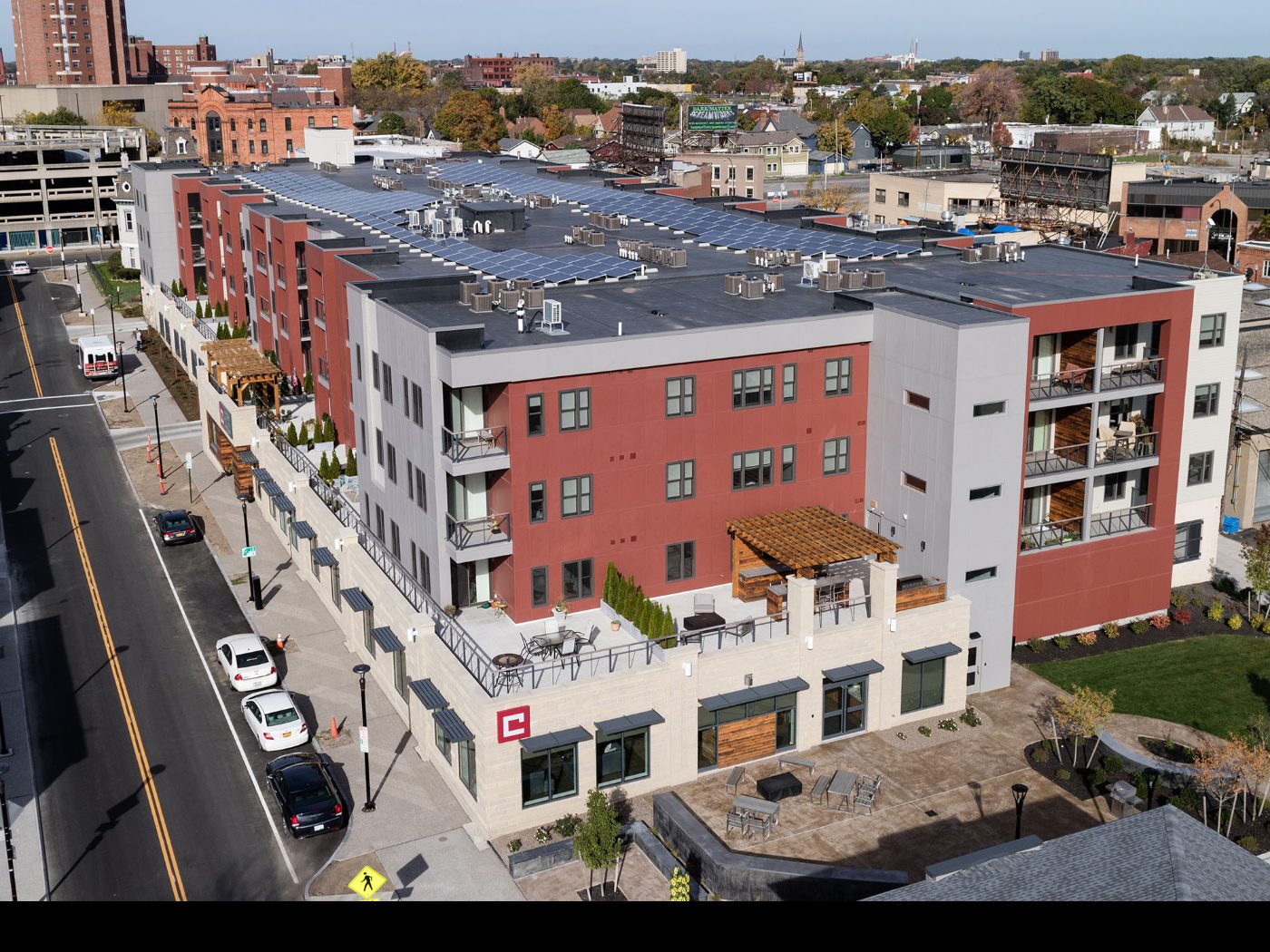 Charlotte Square from above, with the rooftop solar array and the pocket park terrace